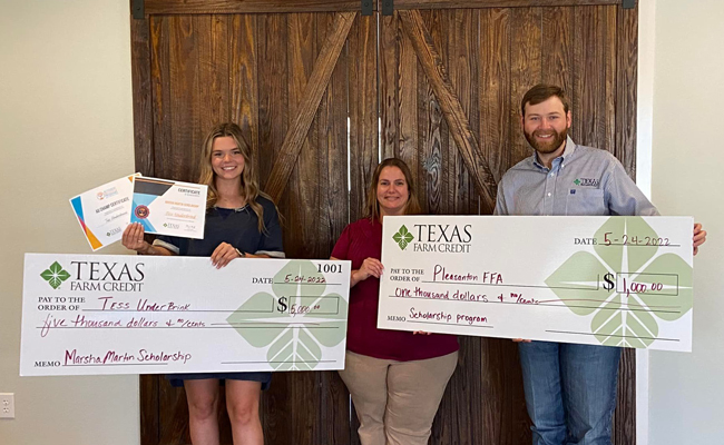 Texas Farm Credit team presenting large check donation to two organizations